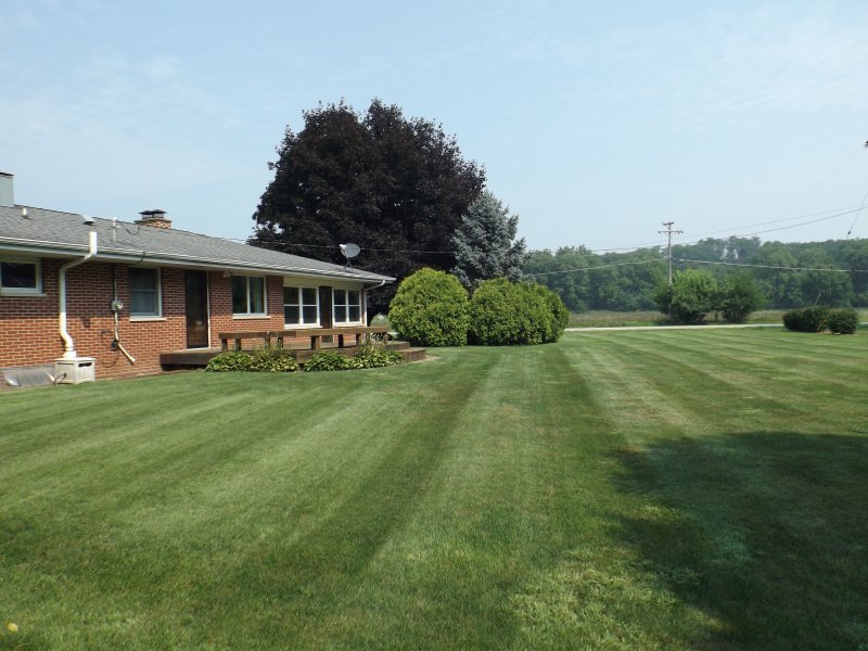 340 Tree Lane Prophetstown, IL 61277 - Photo 4 of 30 a front view of a house with garden