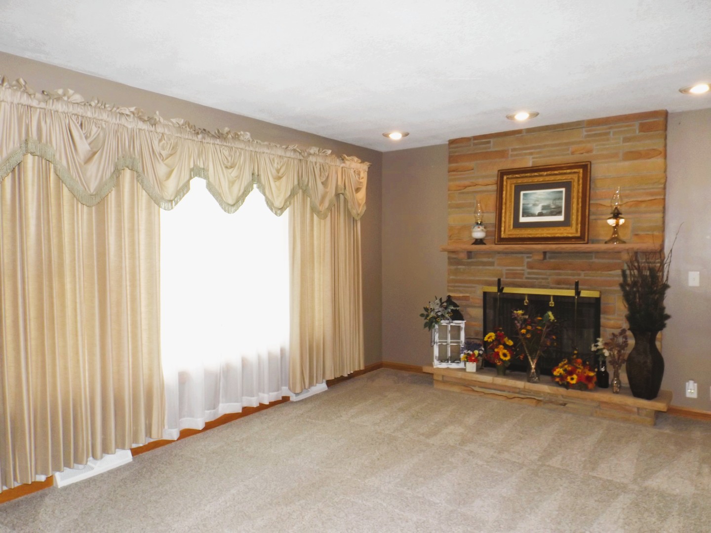 340 Tree Lane Prophetstown, IL 61277 - Photo 6 of 30 a view of a livingroom with an empty space and a fireplace