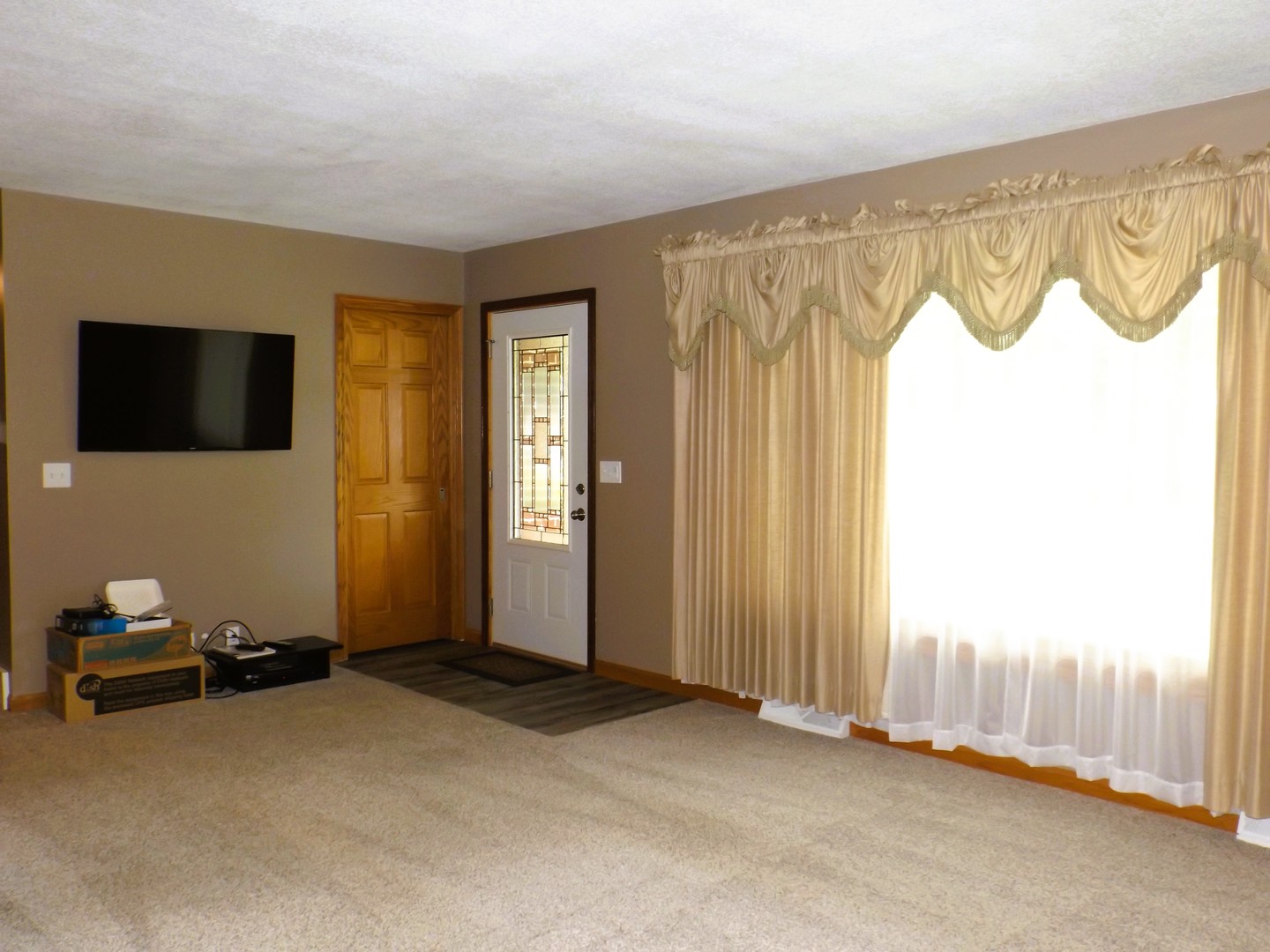 340 Tree Lane Prophetstown, IL 61277 - Photo 8 of 30 a view of a livingroom with entryway wooden floor and windows