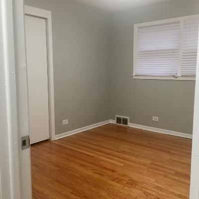 3439 West 84th Street Chicago, IL 60652 - Photo 15 of 32 an empty room with wooden floor and windows
