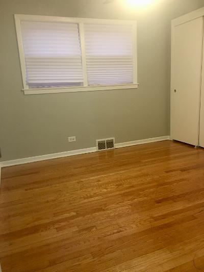 3439 West 84th Street Chicago, IL 60652 - Photo 16 of 32 a view of an empty room with window and wooden floor