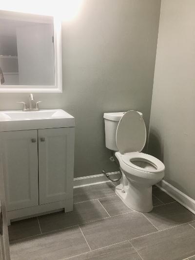 3439 West 84th Street Chicago, IL 60652 - Photo 19 of 32 a white toilet sitting next to a bathroom sink