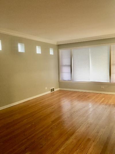 3439 West 84th Street Chicago, IL 60652 - Photo 3 of 32 a view of an empty room with wooden floor and a window