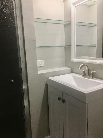 3439 West 84th Street Chicago, IL 60652 - Photo 22 of 32 a bathroom with a sink and mirror