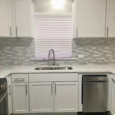 3439 West 84th Street Chicago, IL 60652 - Photo 8 of 32 a kitchen with granite countertop white cabinets and a sink