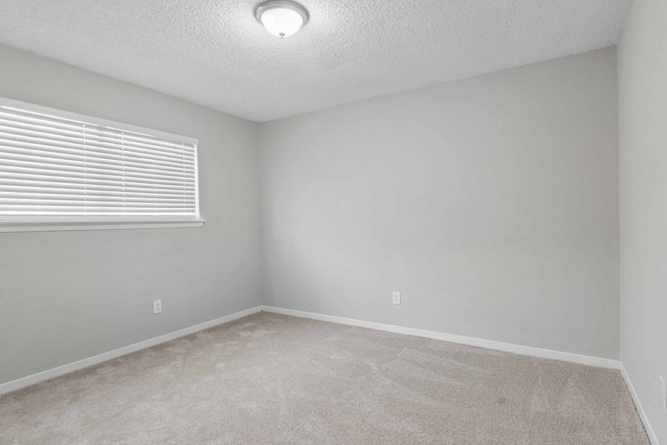 7403 Strawbridge Lane Houston, TX 77040 - Photo 17 of 22 an empty room with a window