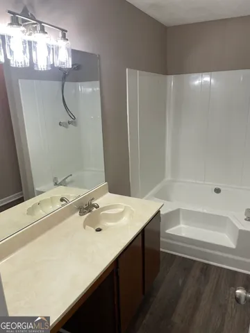 a bathroom with a sink and a mirror