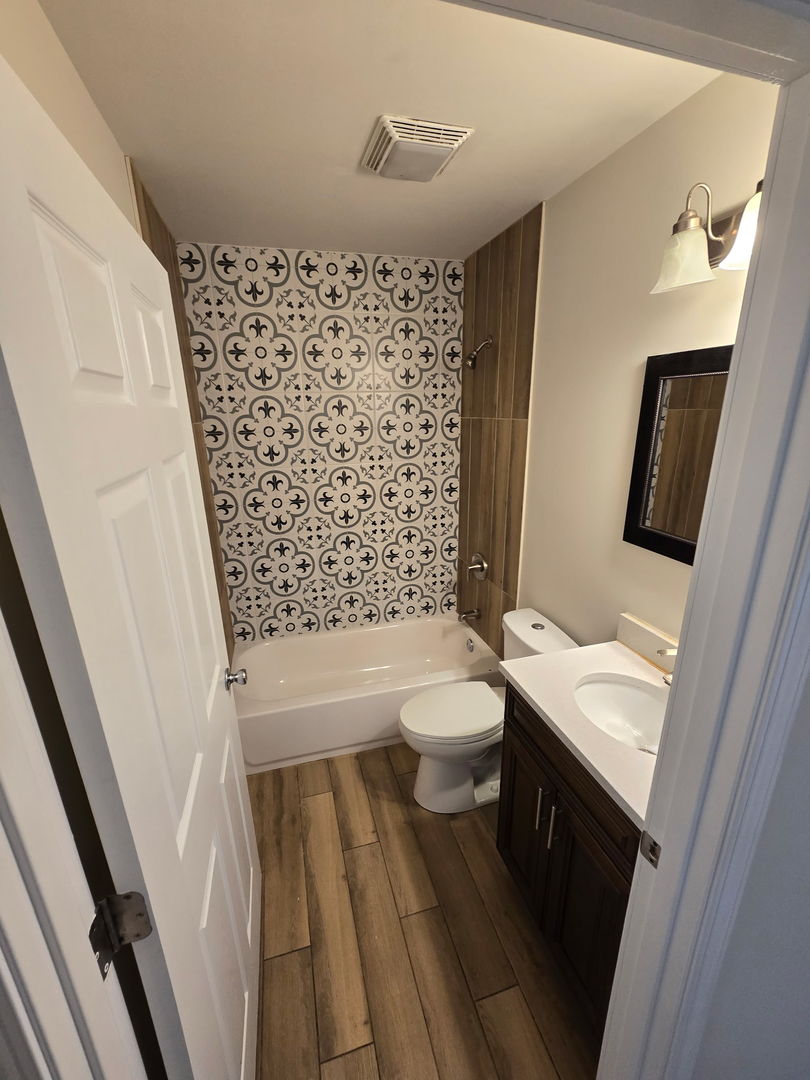 5223 West Washington Boulevard, Unit 52232 Chicago, IL 60644 - Photo 6 of 10 a bathroom with a sink toilet and shower
