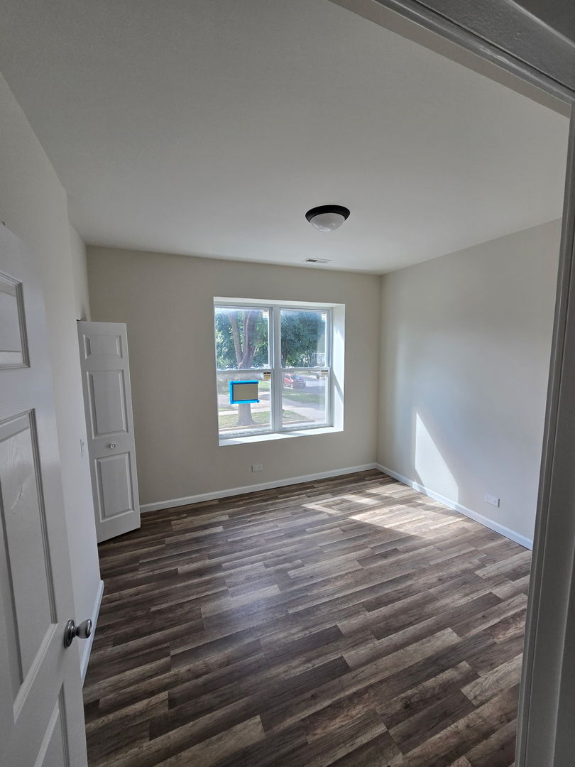 5223 West Washington Boulevard, Unit 52232 Chicago, IL 60644 - Photo 7 of 10 a view of an empty room with a window