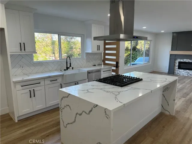 a kitchen with a stove and a microwave