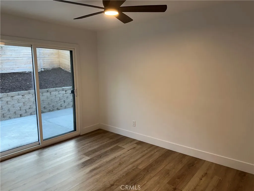 632 Truly Vista, Unit 634 Vista, CA 92084 - Photo 27 of 73 a view of a room with wooden floor and white walls