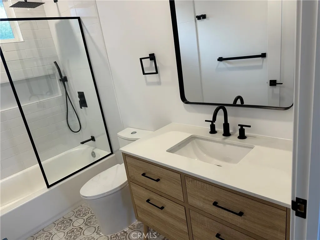 632 Truly Vista, Unit 634 Vista, CA 92084 - Photo 45 of 73 a bathroom with a toilet sink and mirror