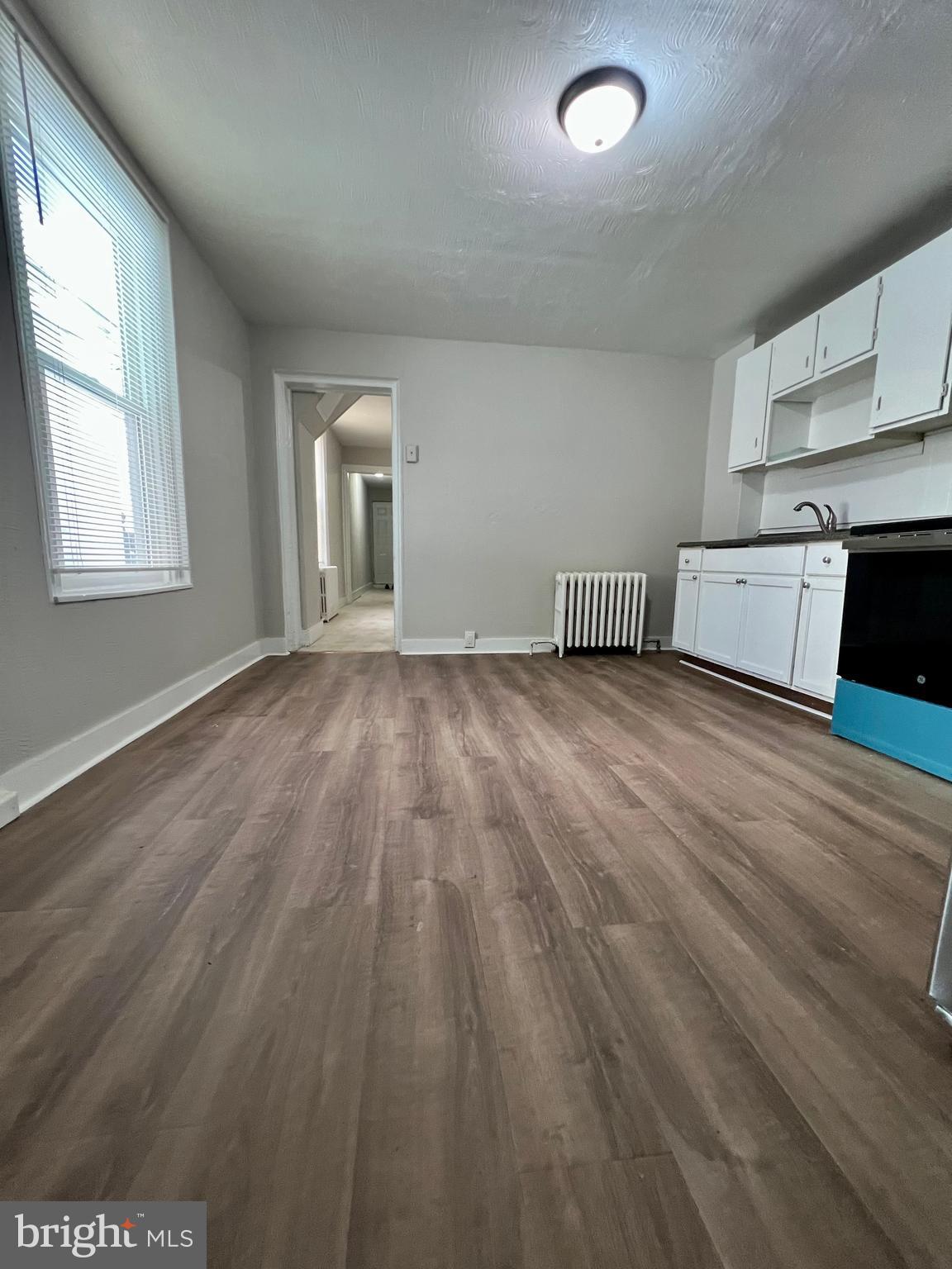 613 Walnut Street Norristown, PA 19401 - Photo 11 of 22 an empty room with wooden floor and windows