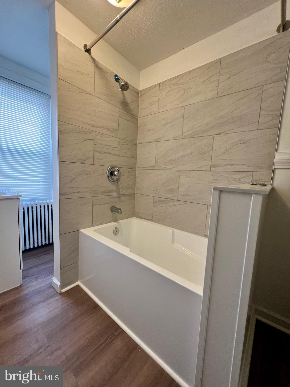 613 Walnut Street Norristown, PA 19401 - Photo 15 of 22 a bathroom with a bathtub and a shower