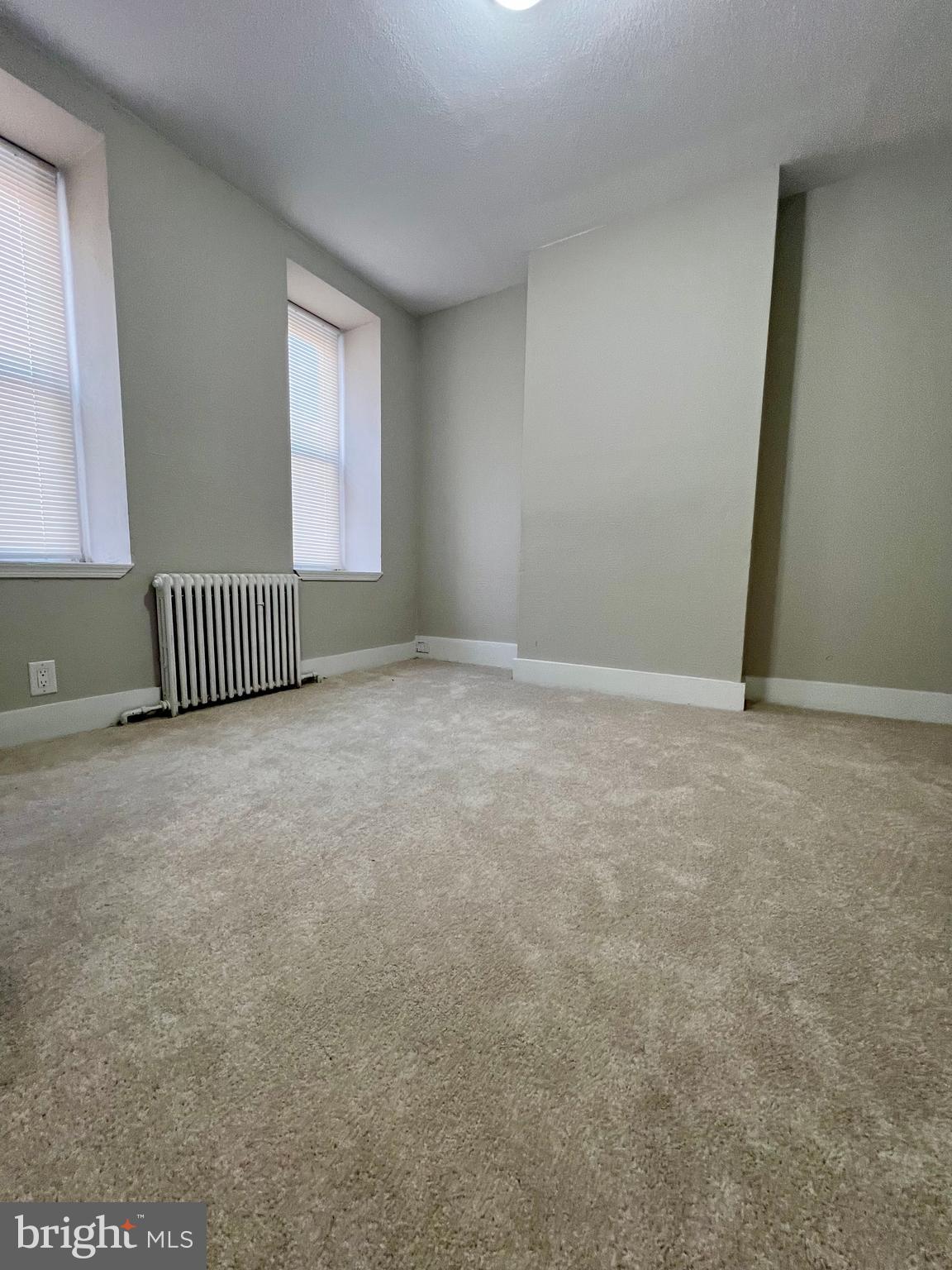 613 Walnut Street Norristown, PA 19401 - Photo 3 of 22 a view of an empty room with a window
