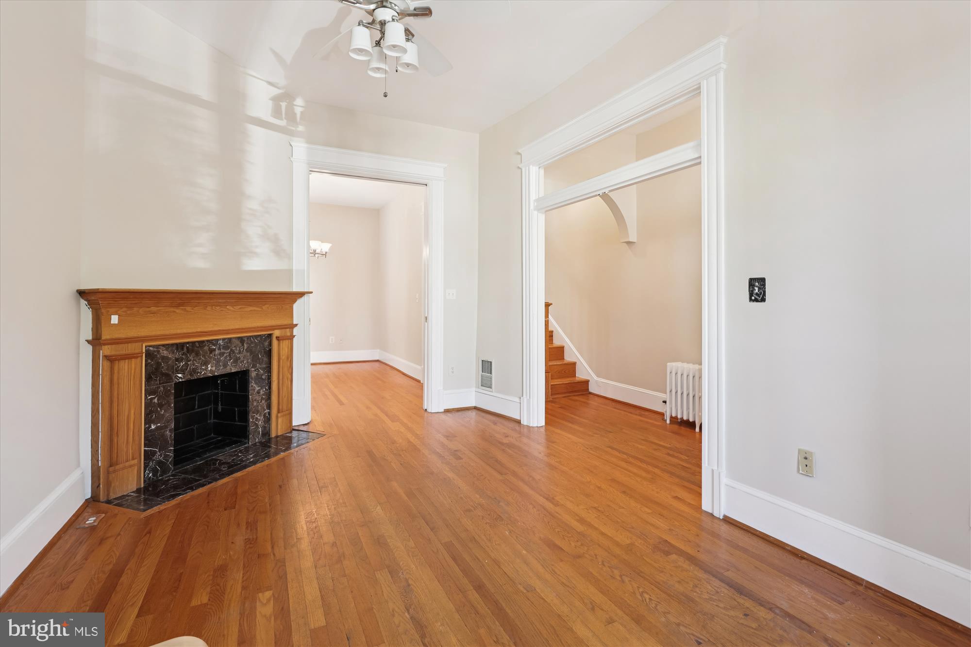 14 Seaton Place Northwest Washington, DC 20001 - Photo 13 of 46 a view of an empty room with wooden floor and a fireplace