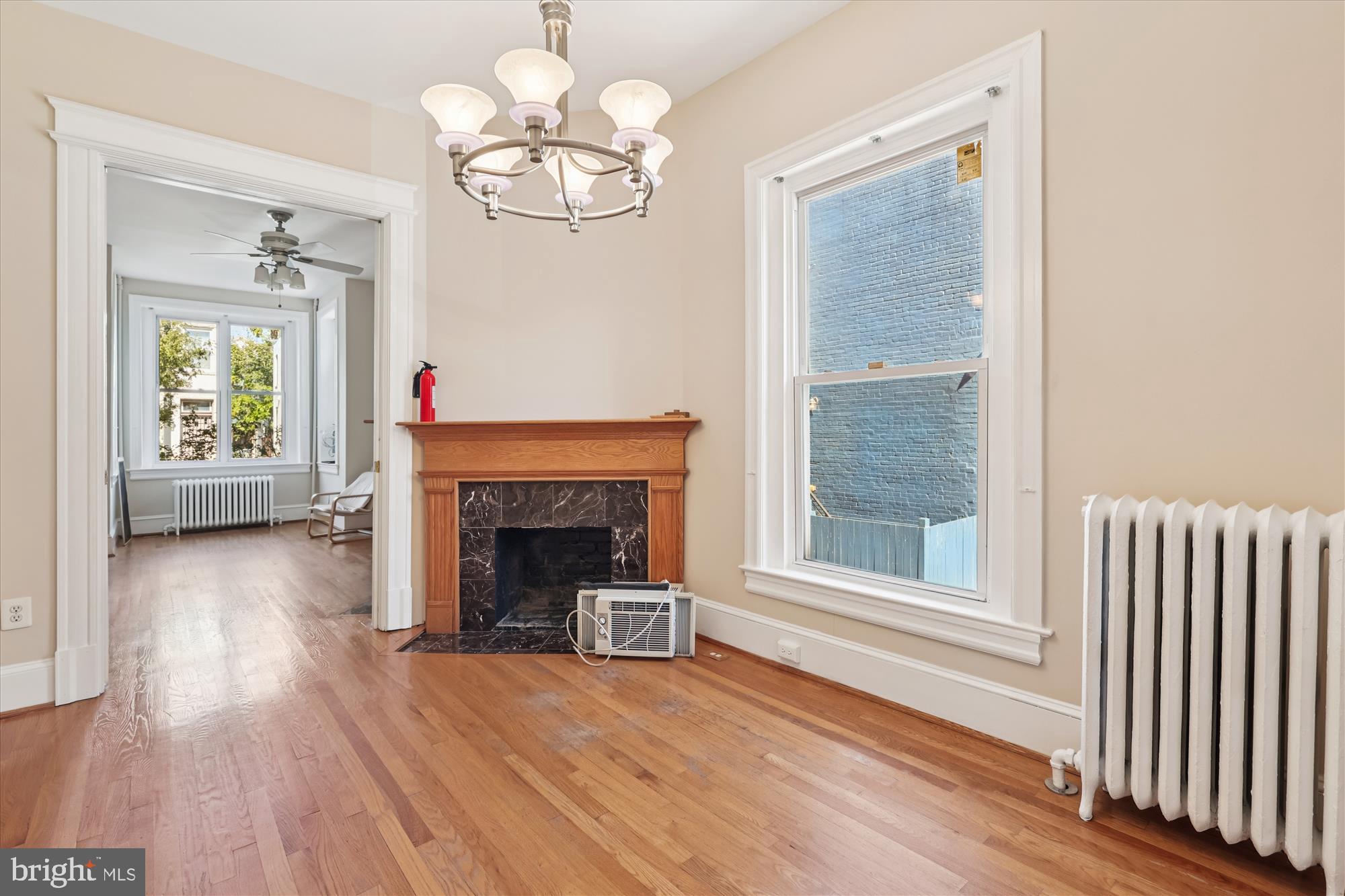 14 Seaton Place Northwest Washington, DC 20001 - Photo 17 of 46 a view of a livingroom with a fireplace wooden floor and windows
