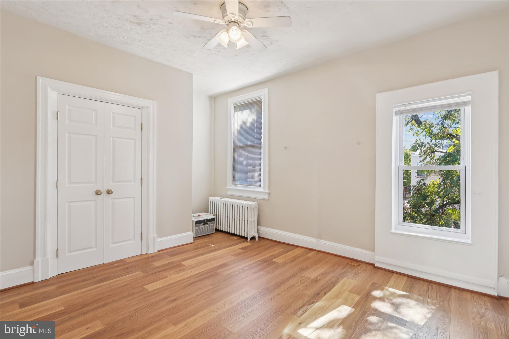 14 Seaton Place Northwest Washington, DC 20001 - Photo 20 of 46 a view of empty room with wooden floor and fan