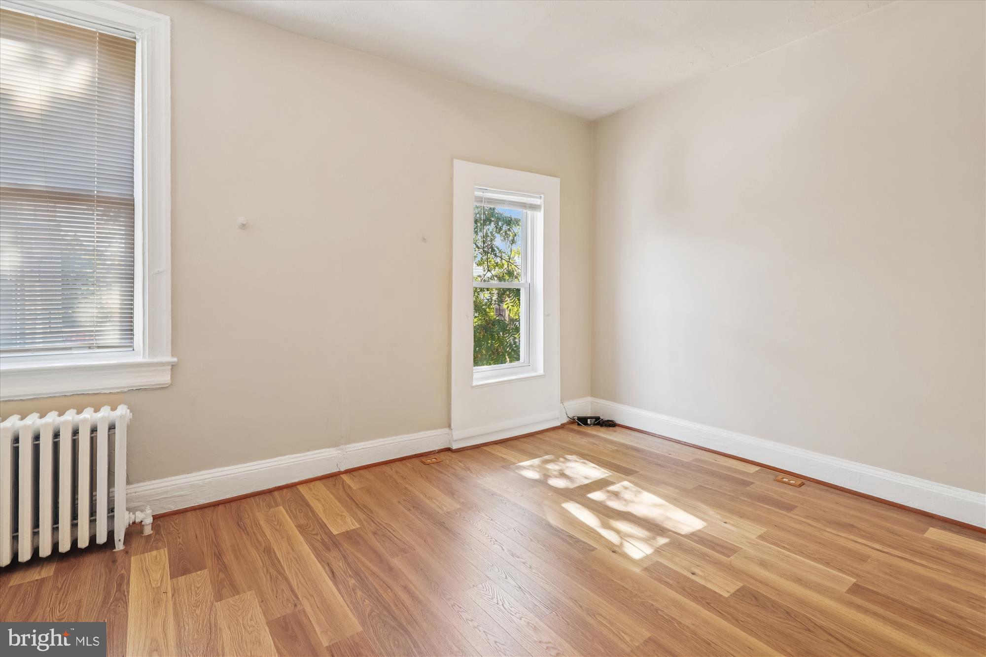14 Seaton Place Northwest Washington, DC 20001 - Photo 22 of 46 a view of an empty room with wooden floor and a window