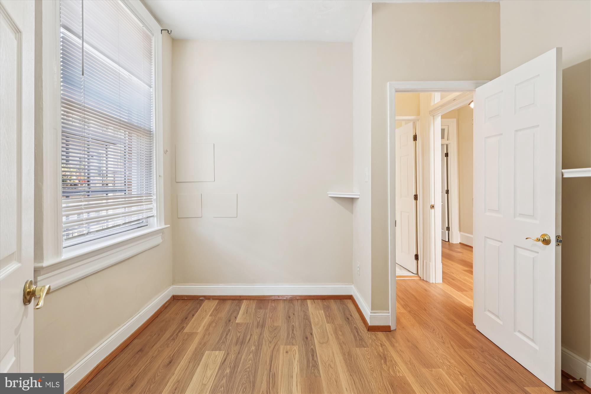 14 Seaton Place Northwest Washington, DC 20001 - Photo 24 of 46 a view of an empty room with wooden floor and a window