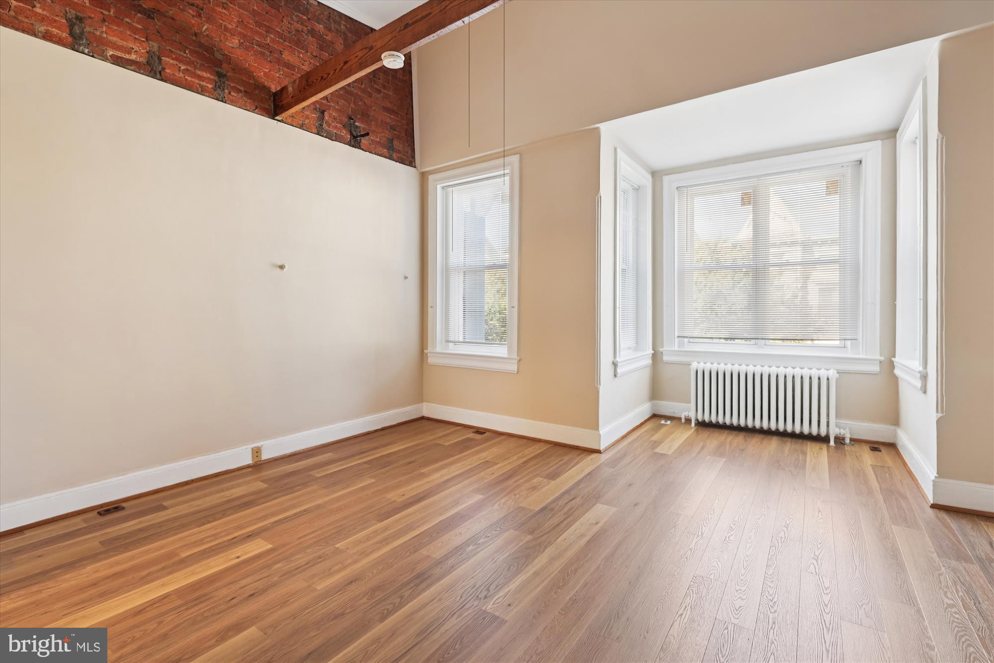 14 Seaton Place Northwest Washington, DC 20001 - Photo 25 of 46 a view of an empty room with a window and wooden floor