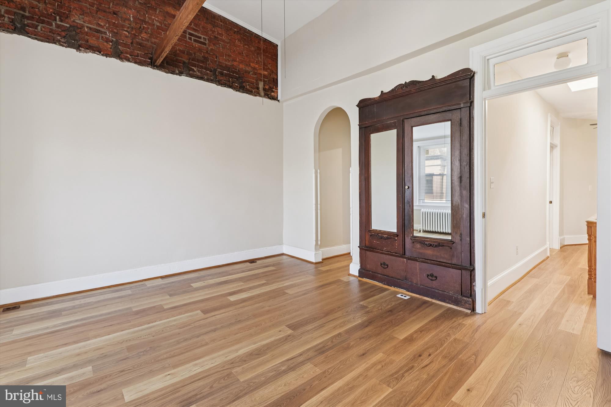 14 Seaton Place Northwest Washington, DC 20001 - Photo 28 of 46 an empty room with wooden floor and closet