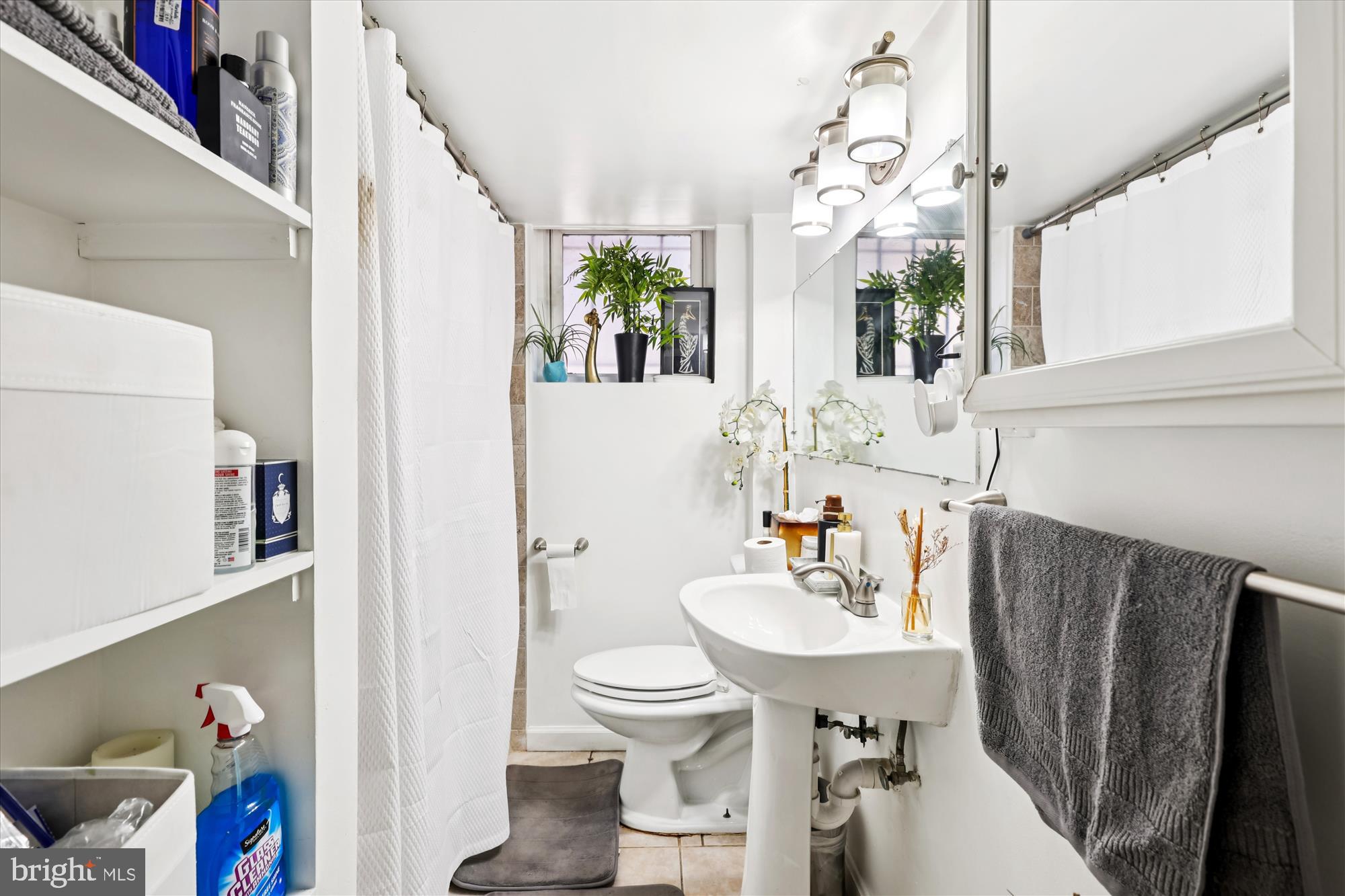 14 Seaton Place Northwest Washington, DC 20001 - Photo 30 of 46 a bathroom with a sink a toilet and a mirror