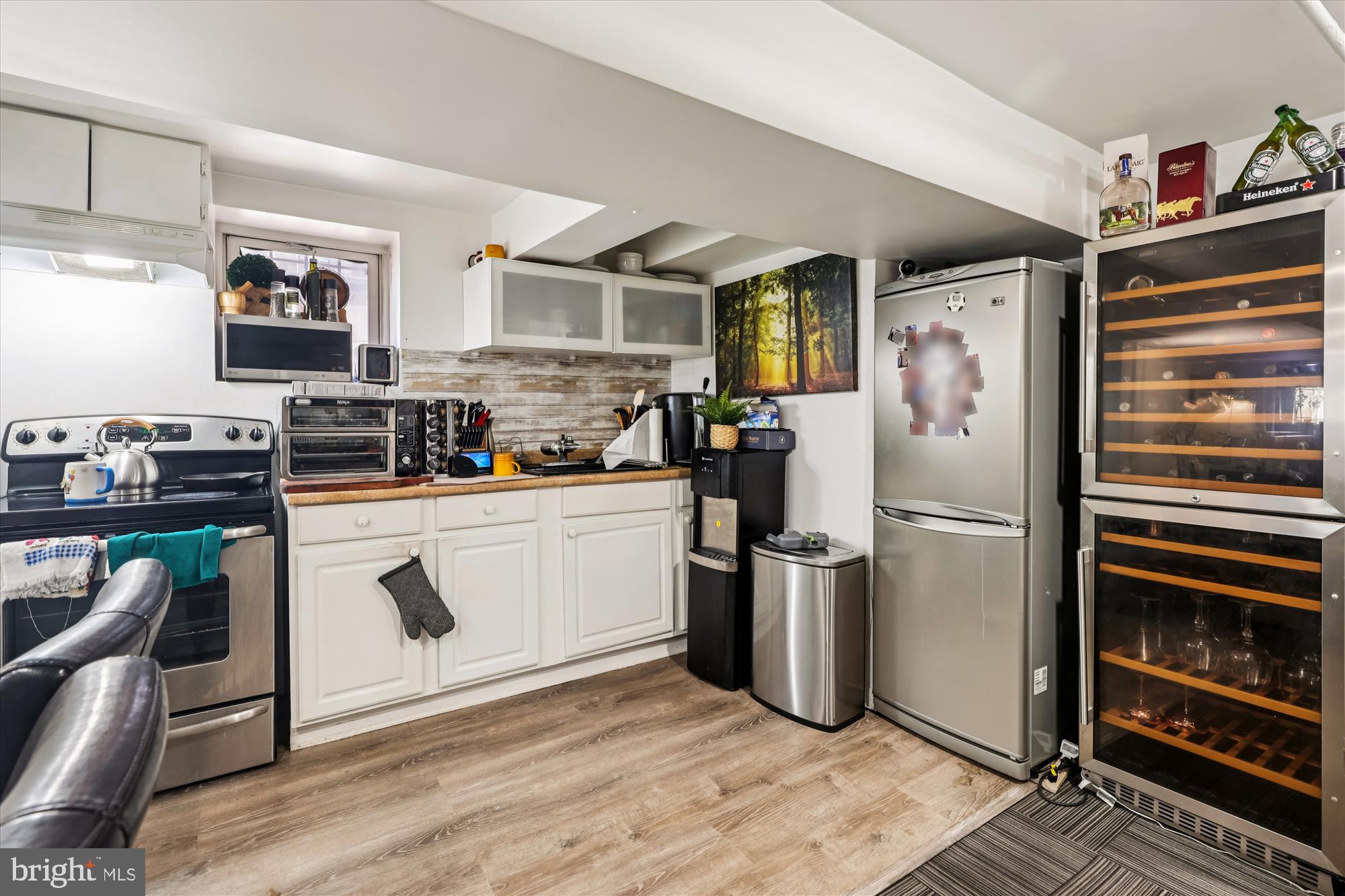 14 Seaton Place Northwest Washington, DC 20001 - Photo 33 of 46 a kitchen with stainless steel appliances a refrigerator stove and sink