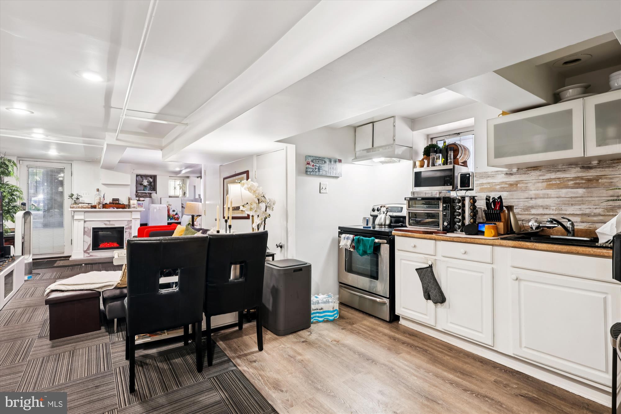 14 Seaton Place Northwest Washington, DC 20001 - Photo 34 of 46 a kitchen with stainless steel appliances granite countertop a refrigerator a stove a sink dishwasher and white cabinets with wooden floor