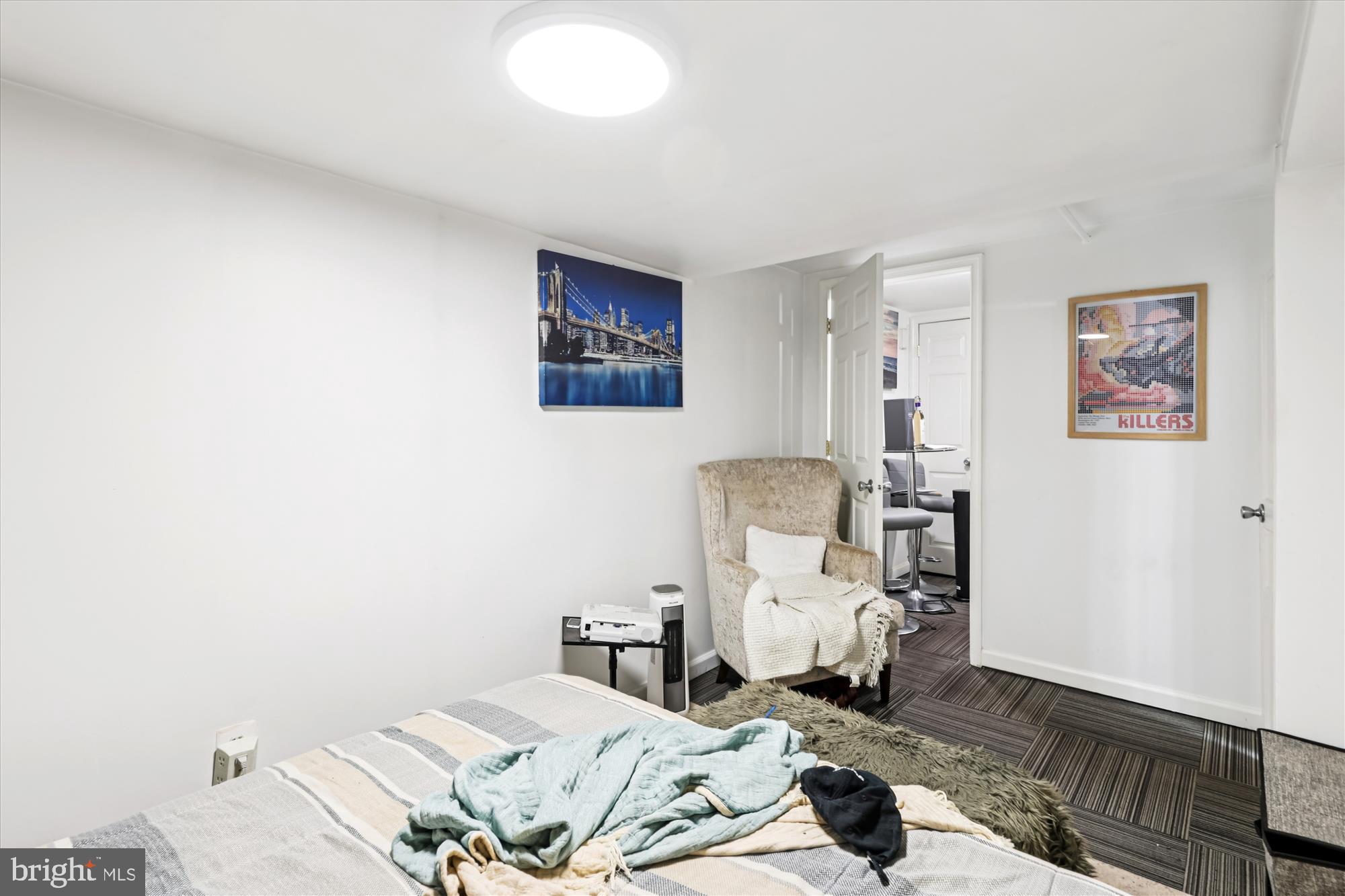 14 Seaton Place Northwest Washington, DC 20001 - Photo 35 of 46 a bedroom with a bed and wooden floor