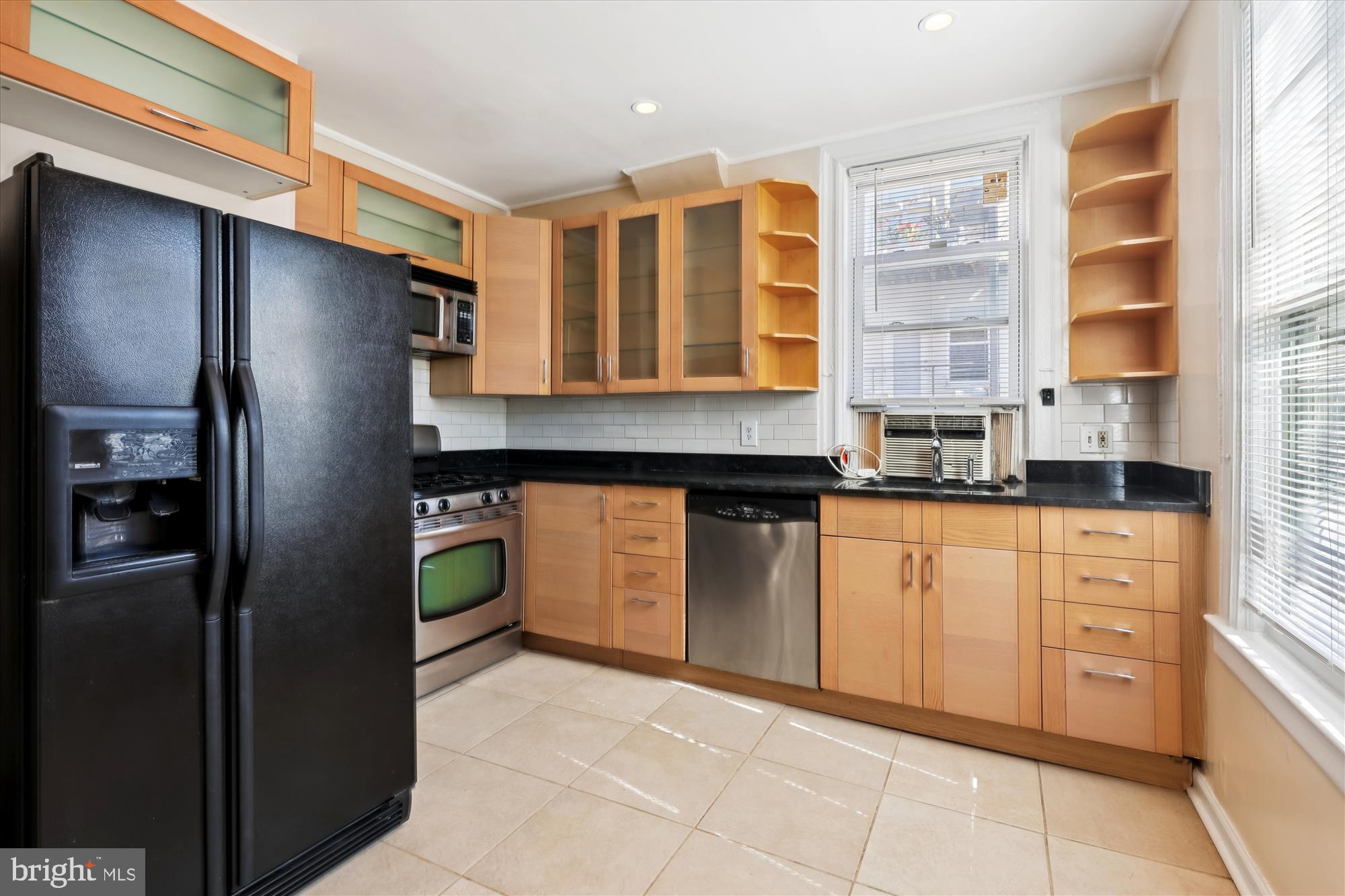 14 Seaton Place Northwest Washington, DC 20001 - Photo 4 of 46 a kitchen with stainless steel appliances granite countertop a refrigerator and a sink
