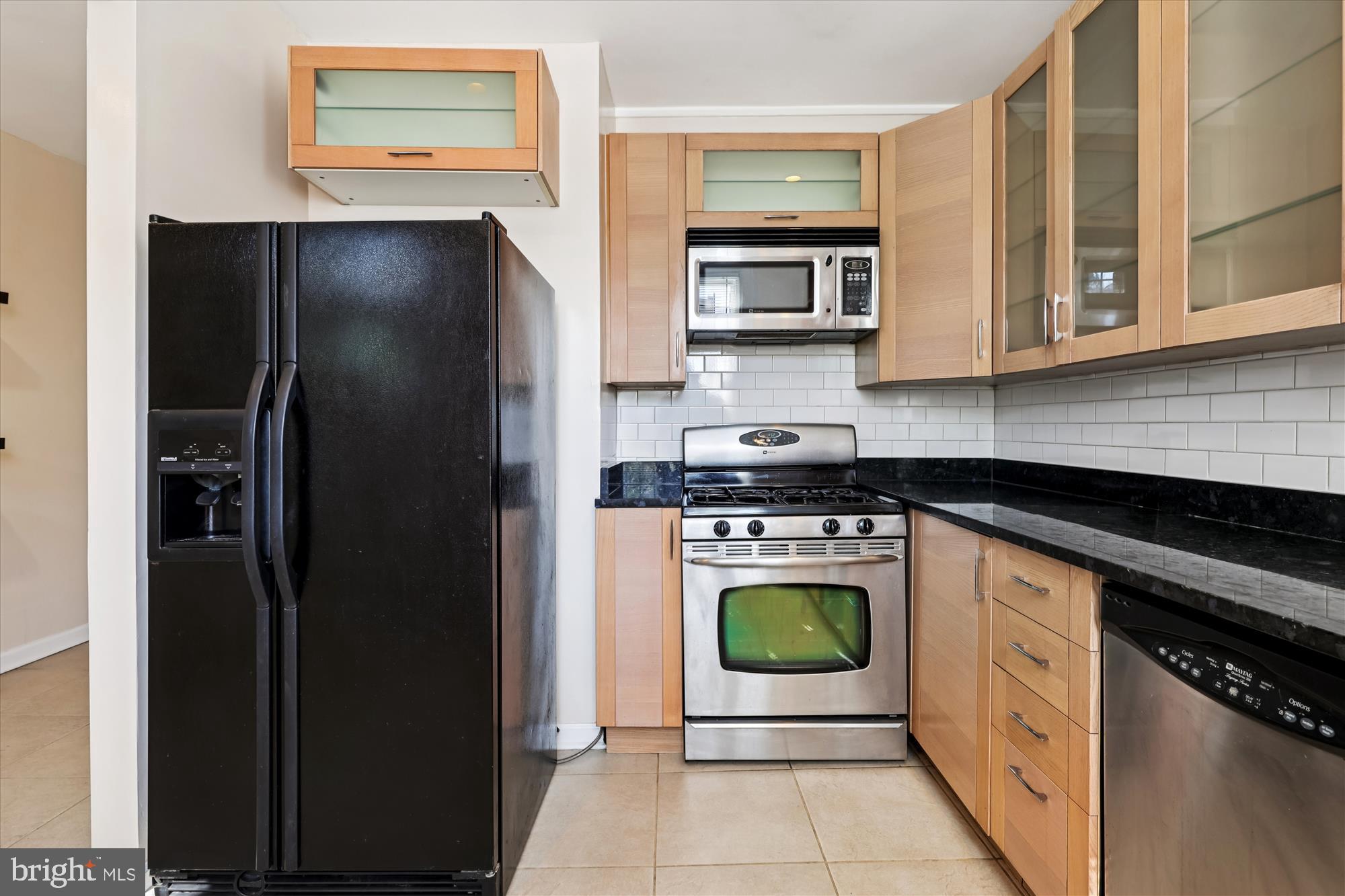 14 Seaton Place Northwest Washington, DC 20001 - Photo 6 of 46 a kitchen with stainless steel appliances granite countertop a refrigerator a stove and a sink