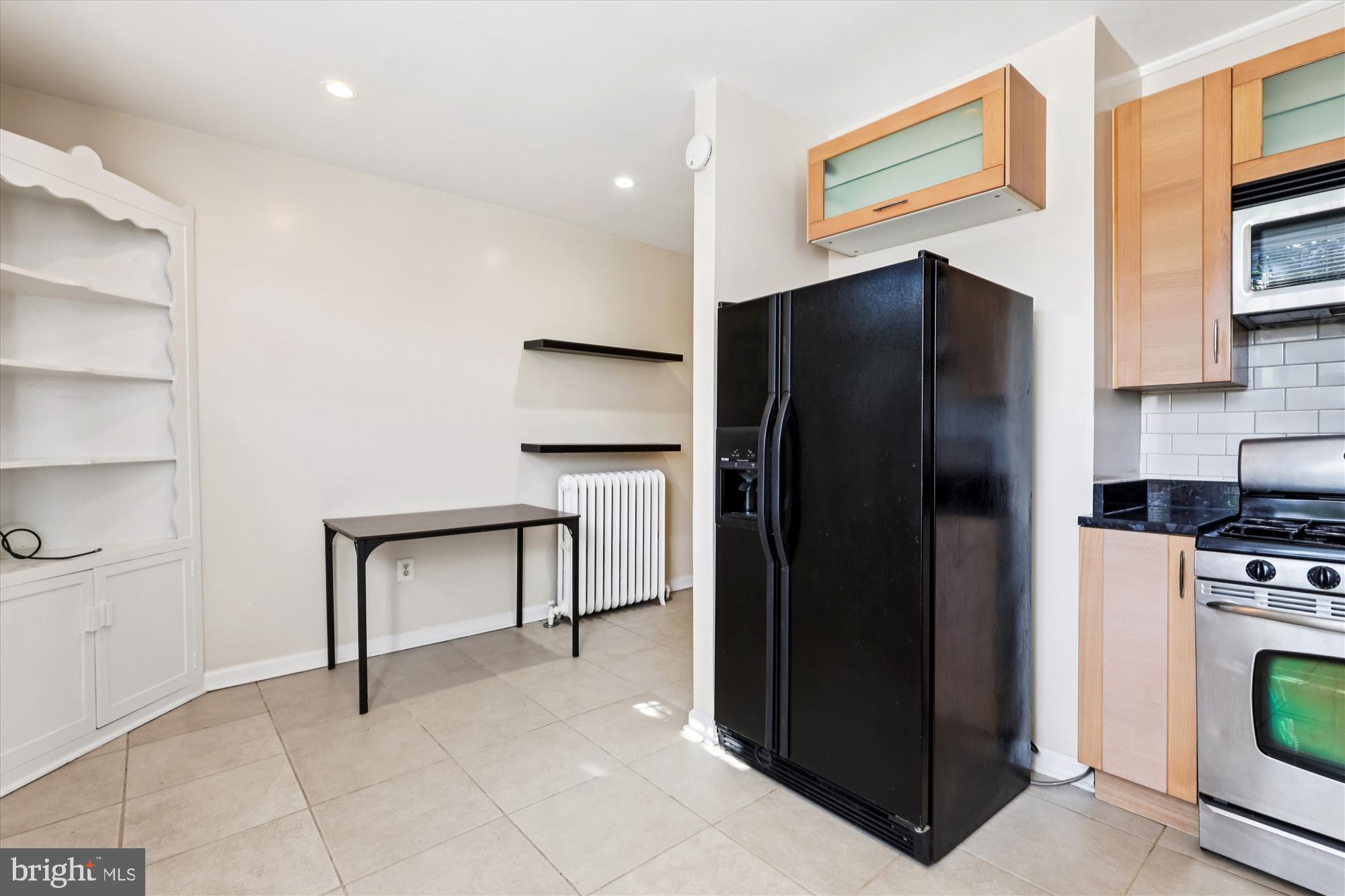 14 Seaton Place Northwest Washington, DC 20001 - Photo 7 of 46 a kitchen with stainless steel appliances a refrigerator and a stove top oven