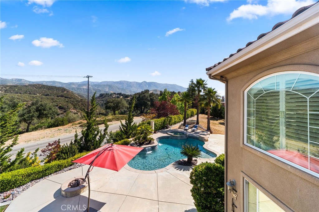 38136 Butterfly Court Yucaipa, CA 92399 - Photo 51 of 71 a view of a house with a yard and balcony