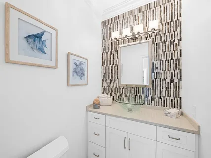 a bedroom with a bed and ceiling fan