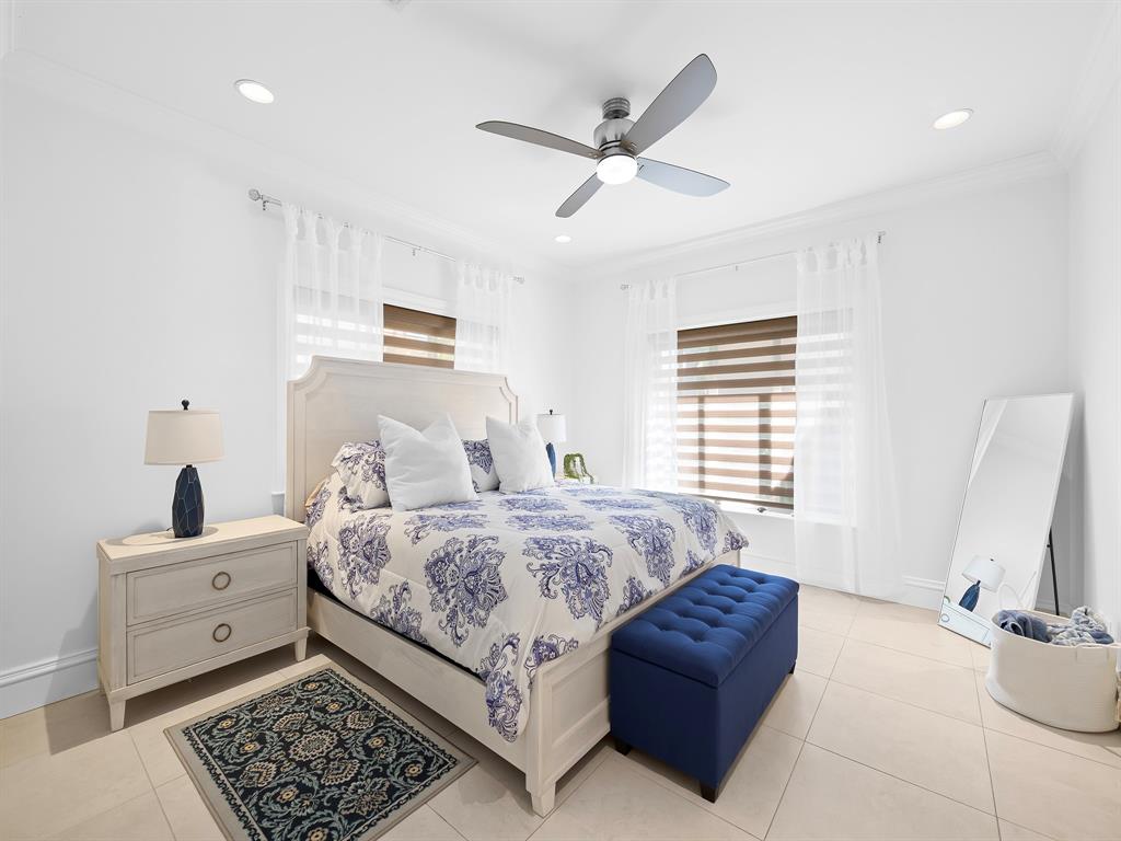 2228 Northeast 26th Street Lighthouse Point, FL 33064 - Photo 23 of 36 a spacious bedroom with a bed and a window