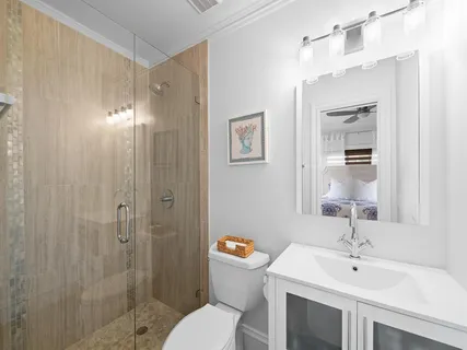 a bedroom with two beds and painting on the wall