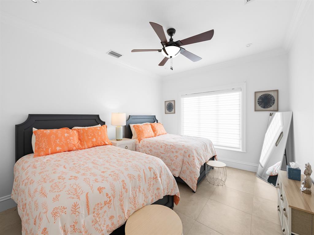 2228 Northeast 26th Street Lighthouse Point, FL 33064 - Photo 25 of 36 a bedroom with two beds and painting on the wall