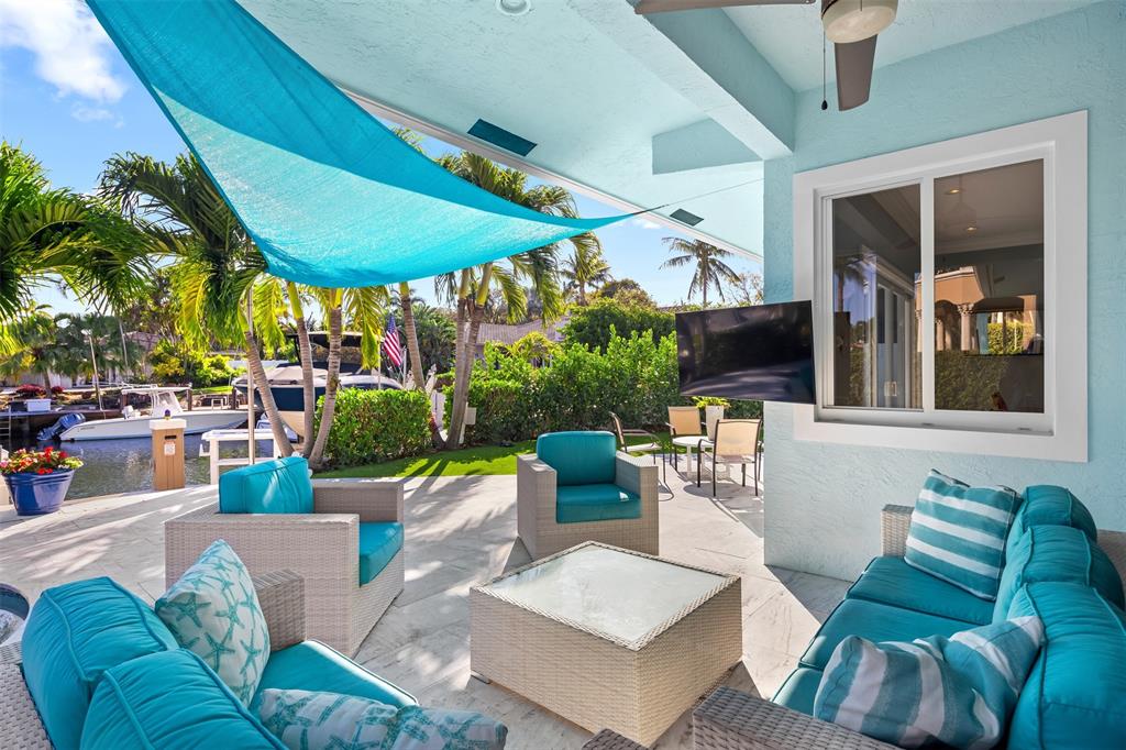 2228 Northeast 26th Street Lighthouse Point, FL 33064 - Photo 28 of 36 a view of a patio with couches table and chairs