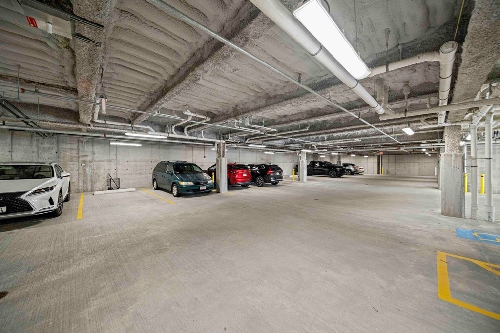 200 Revere Street, Unit 4103 Canton, MA 02021 - Photo 23 of 39 a view of parking garage with cars