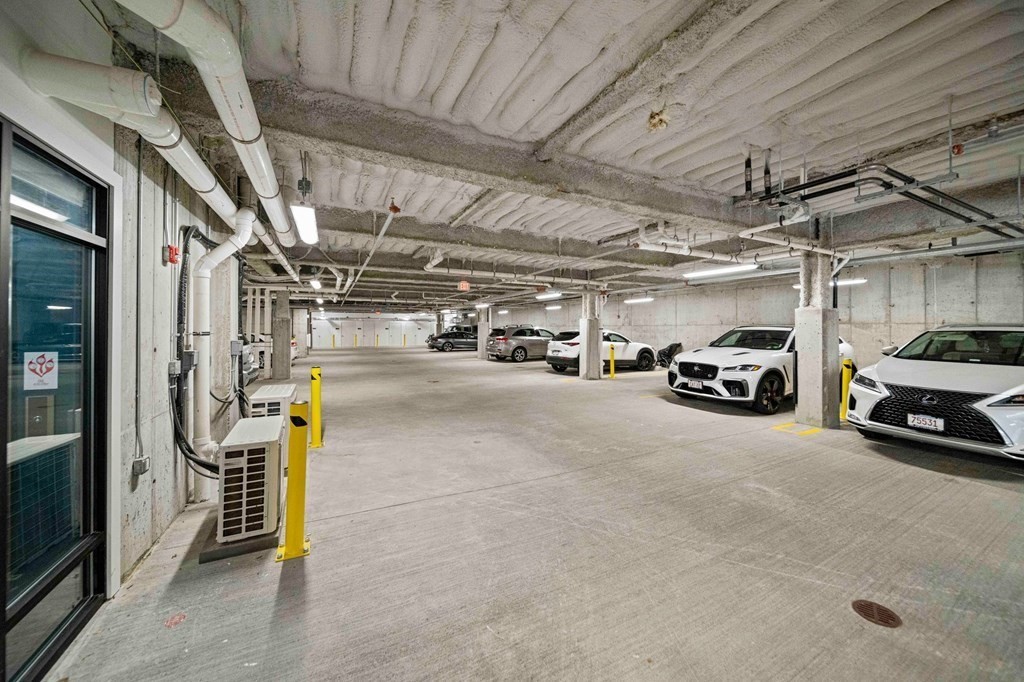 200 Revere Street, Unit 4103 Canton, MA 02021 - Photo 24 of 39 a view of parking garage with cars