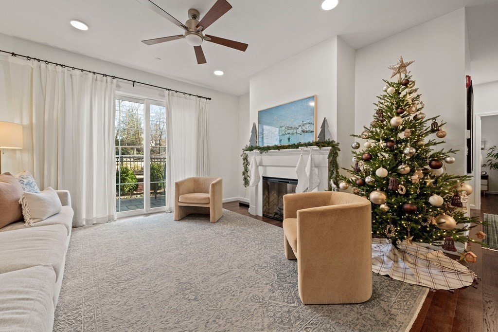200 Revere Street, Unit 4103 Canton, MA 02021 - Photo 9 of 39 a living room with furniture and a fireplace