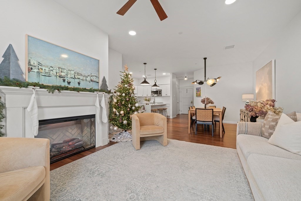 200 Revere Street, Unit 4103 Canton, MA 02021 - Photo 10 of 39 a living room with furniture and a fireplace