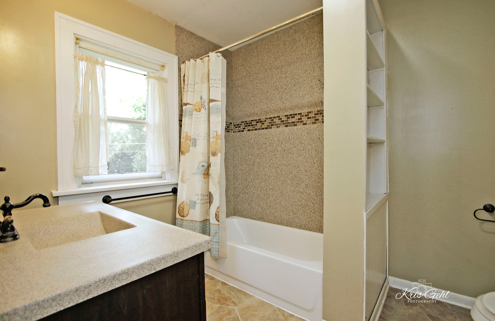 1038 Ferndale Street Gurnee, IL 60031 - Photo 15 of 24 a bathroom with a granite countertop sink and a bathtub