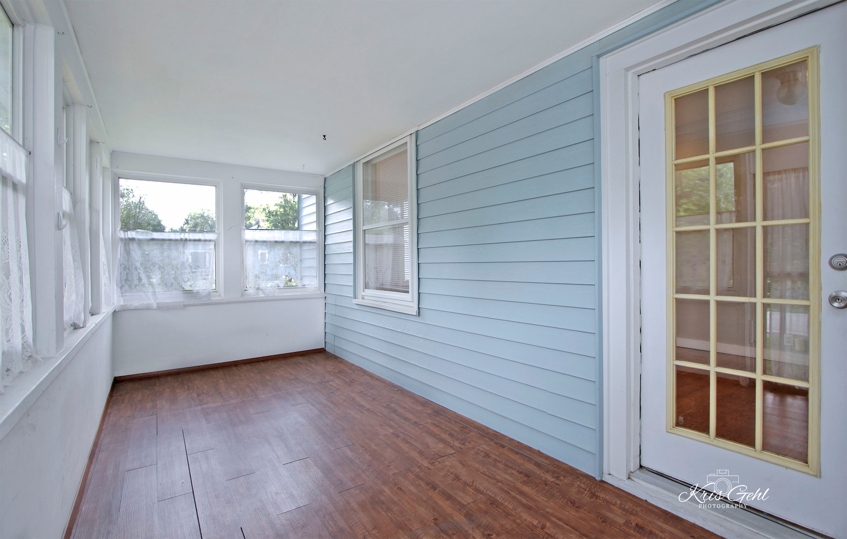1038 Ferndale Street Gurnee, IL 60031 - Photo 3 of 24 a view of an empty room with a window and wooden floor