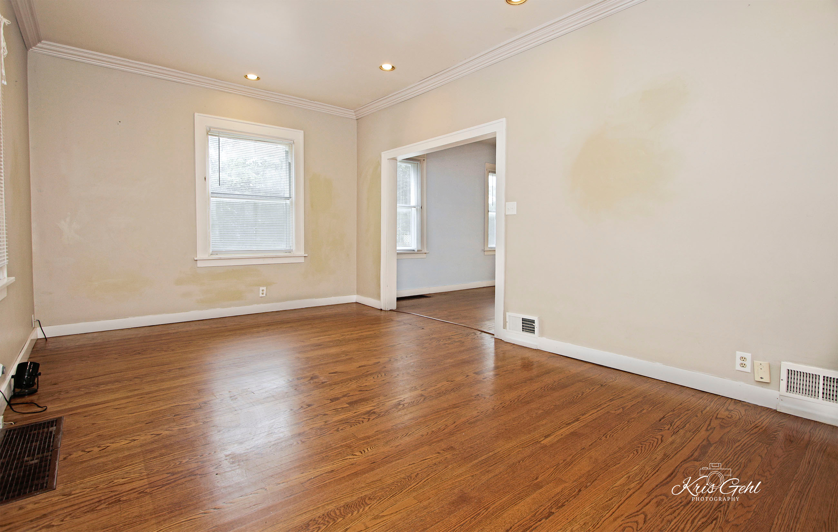 1038 Ferndale Street Gurnee, IL 60031 - Photo 4 of 24 an empty room with wooden floor and windows