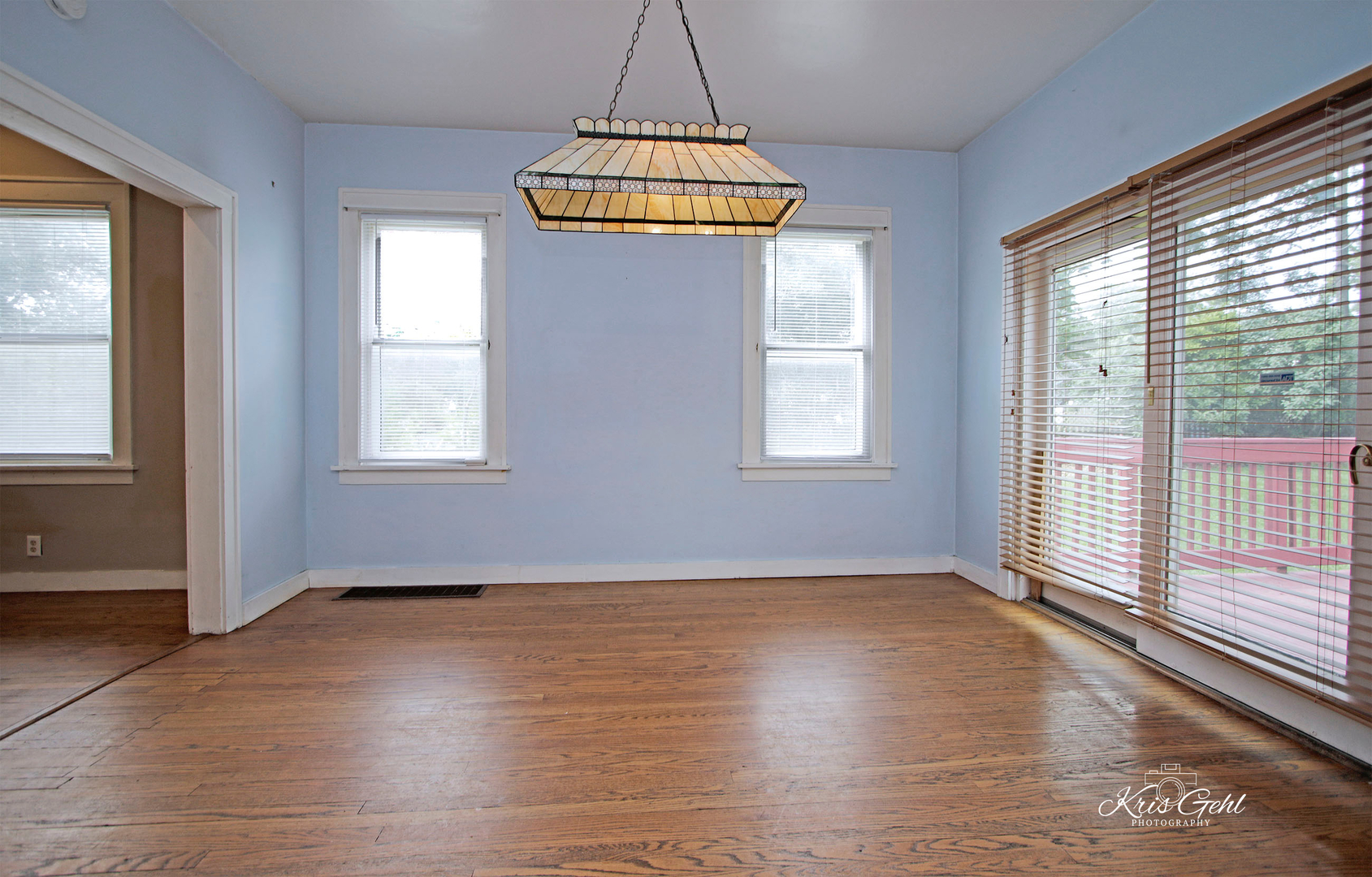 1038 Ferndale Street Gurnee, IL 60031 - Photo 9 of 24 an empty room with wooden floor and windows
