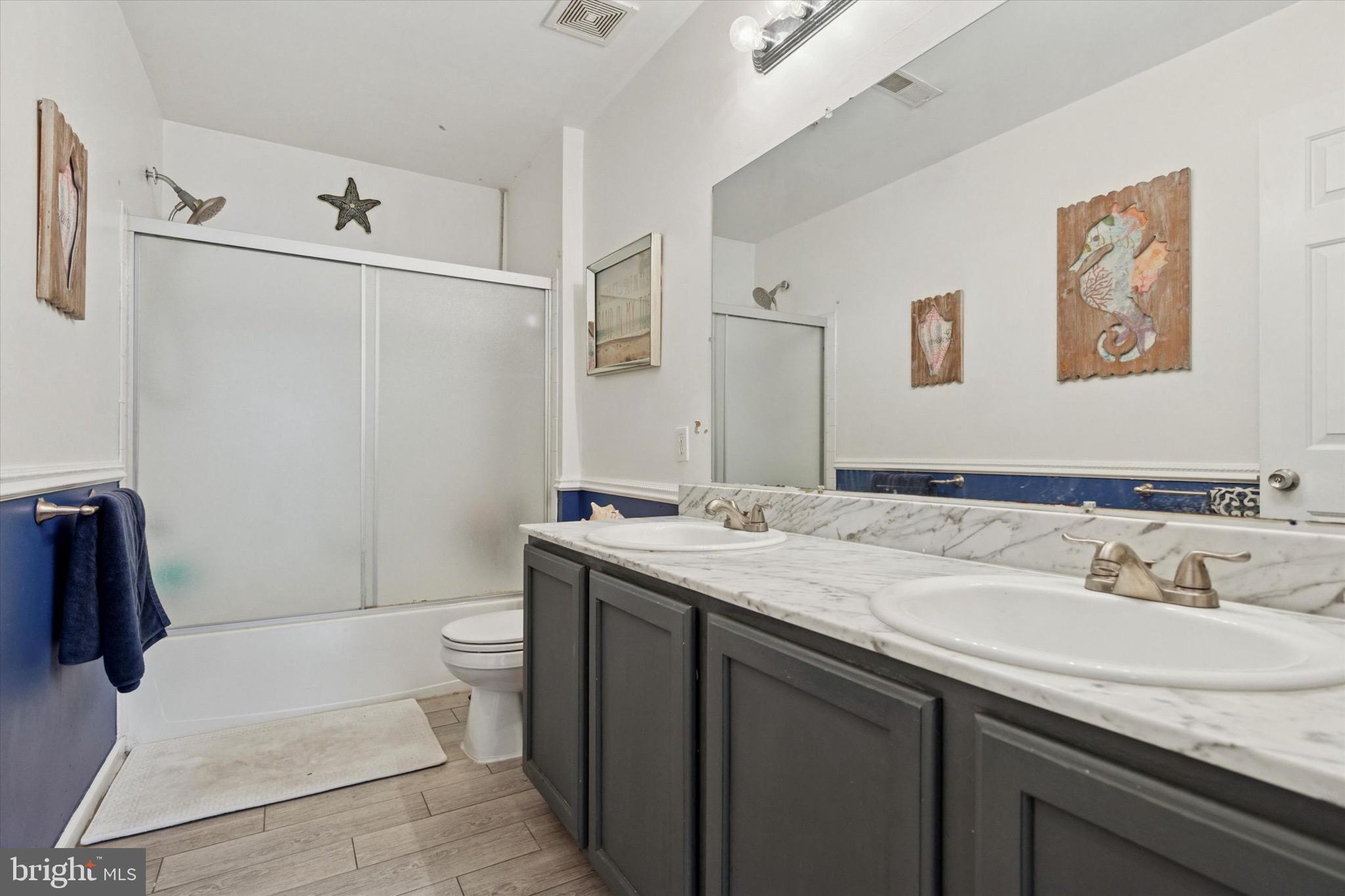 803 Sweet Cherry Street Warrington, PA 18976 - Photo 13 of 35 a bathroom with a sink and mirror with toilet