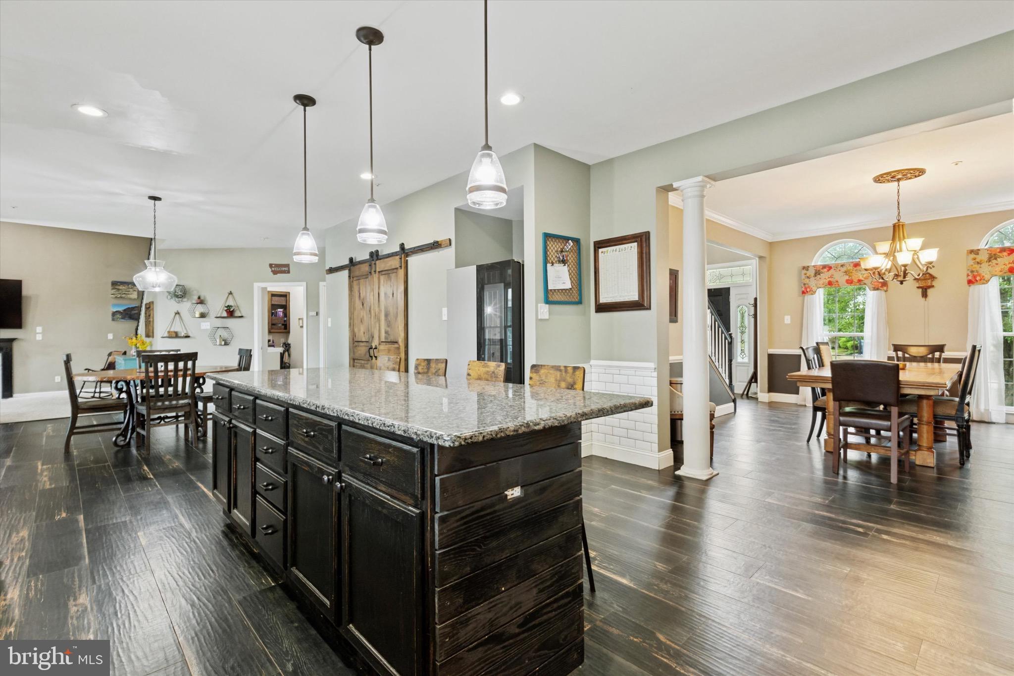 803 Sweet Cherry Street Warrington, PA 18976 - Photo 16 of 35 a kitchen with stainless steel appliances granite countertop a table chairs stove a refrigerator and kitchen view