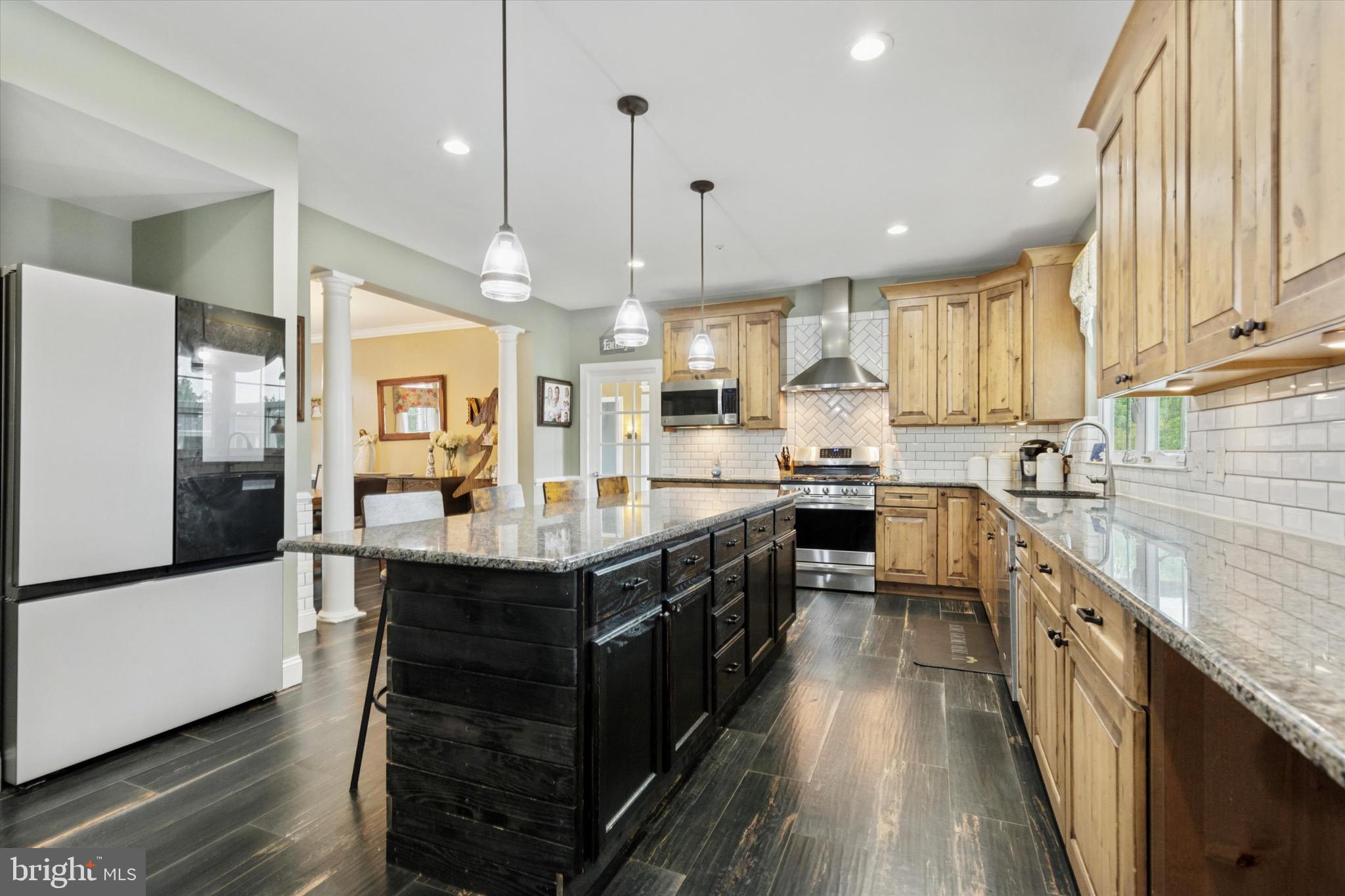 803 Sweet Cherry Street Warrington, PA 18976 - Photo 17 of 35 a kitchen with stainless steel appliances granite countertop wooden cabinets a sink a stove a refrigerator and a stove